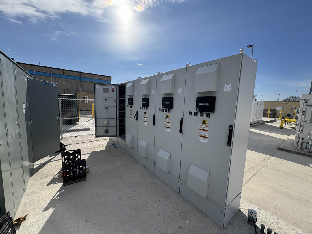 Row of electrical cabinets installed on a concrete pad
