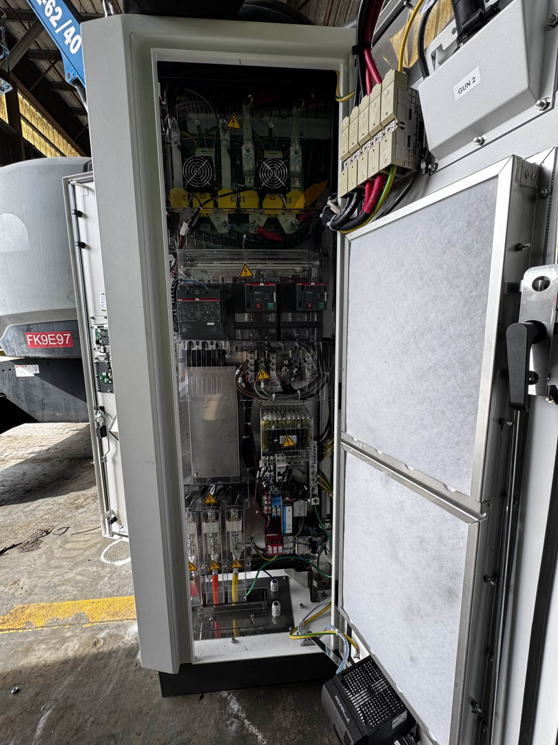 Open EV charging cabinet showing internal electrical controls