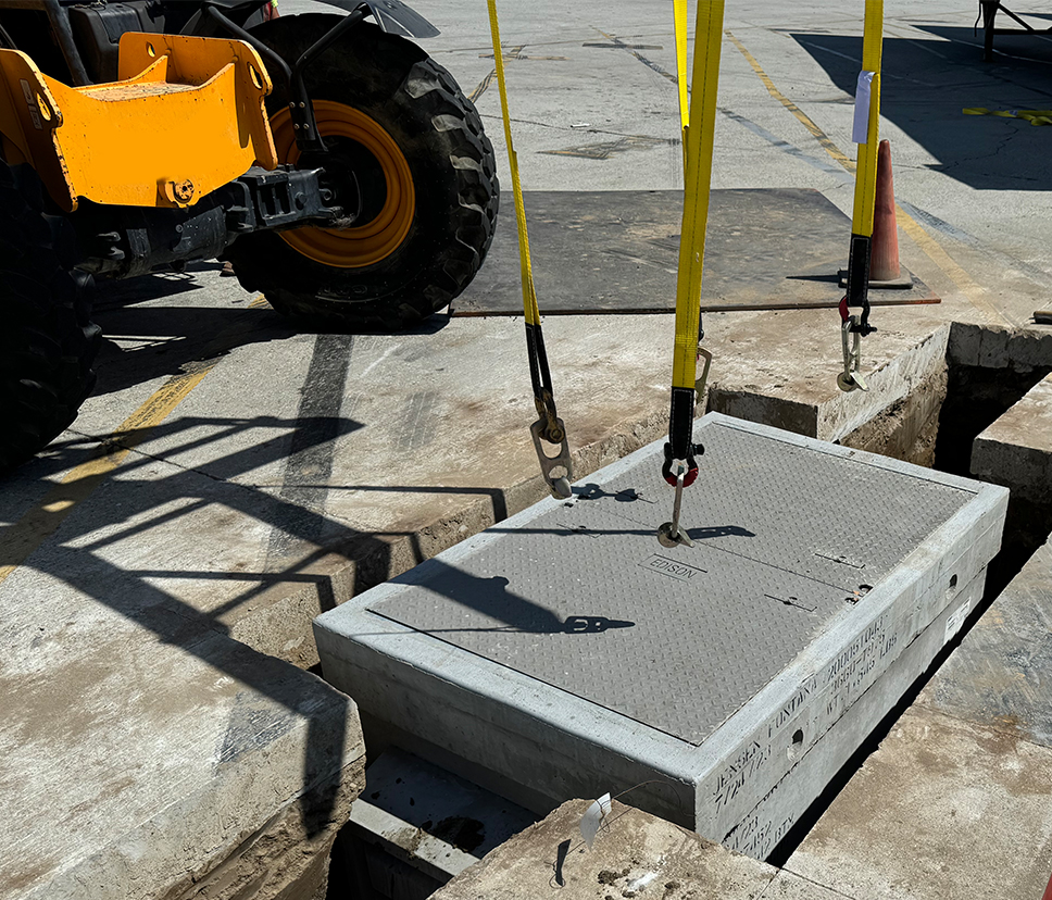 Underground conduits entering a concrete utility vault