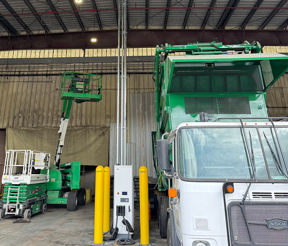 EV charging station installed beside industrial fleet equipment