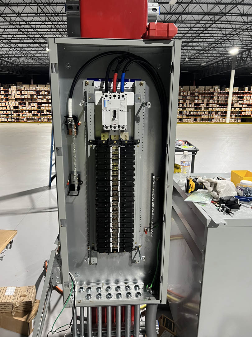 Open electrical panel with wiring and terminal blocks