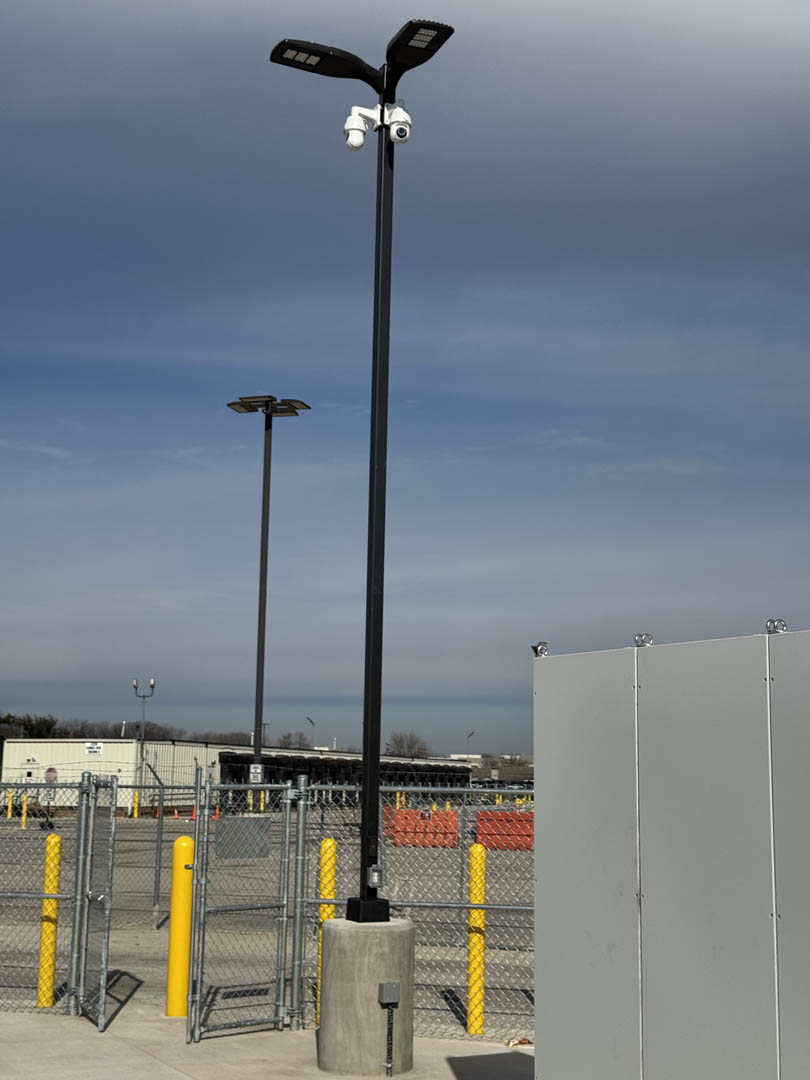 Exterior site lighting and electrical equipment at an industrial yard